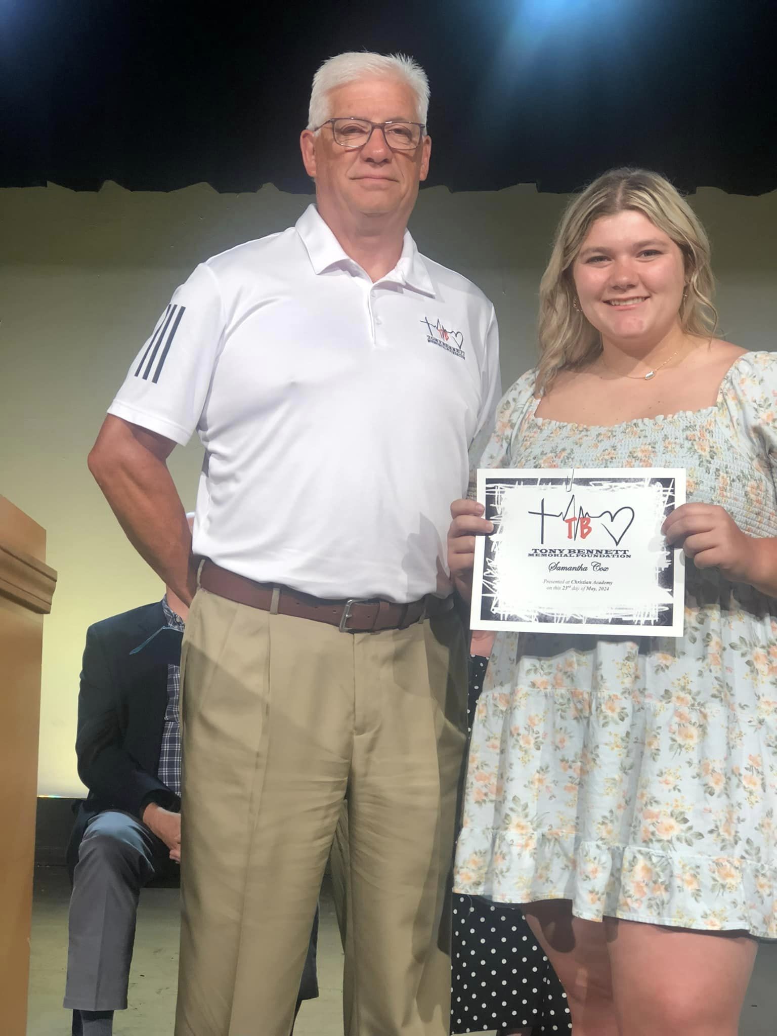 CAI student accepting scholarship.